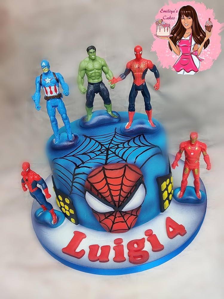 close up of super hero figurines on top of the cake