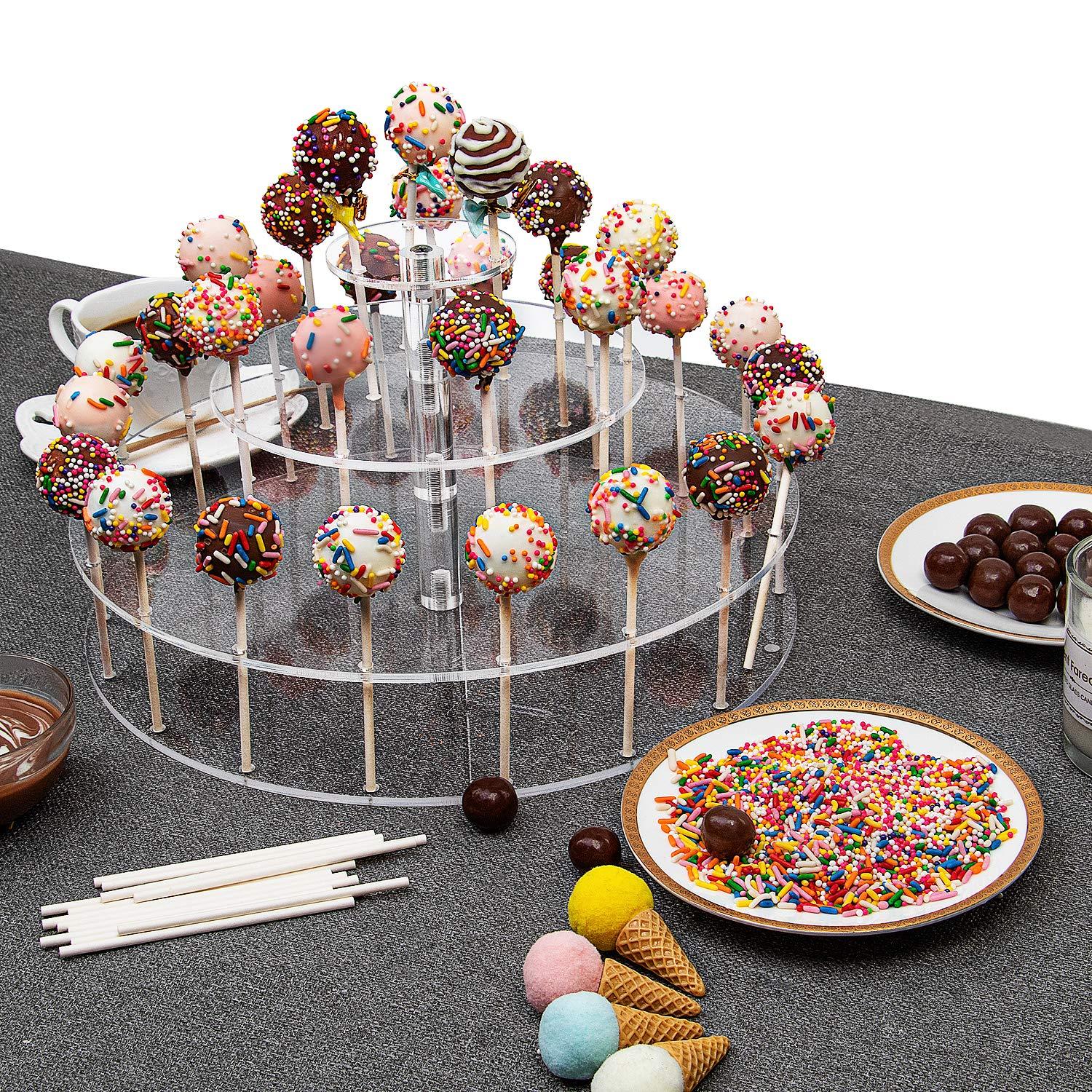 assortment of movie-themed cake pops displayed on a stand