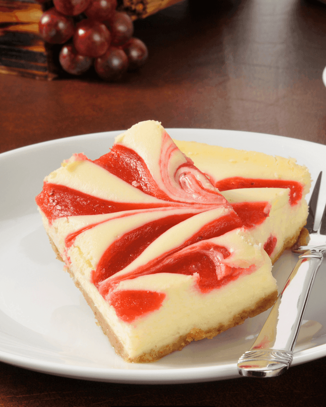 Marbled Strawberry Cheesecake Bars on a white plate