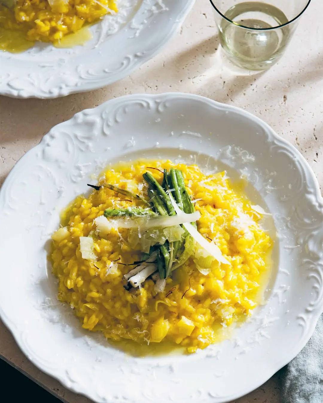 Finished plate of Mussel and Saffron Risotto garnished with parsley