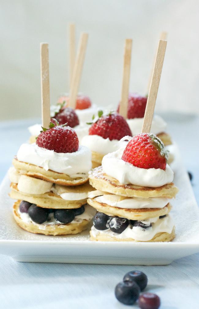 stack of patriotic pancakes with strawberries and blueberries