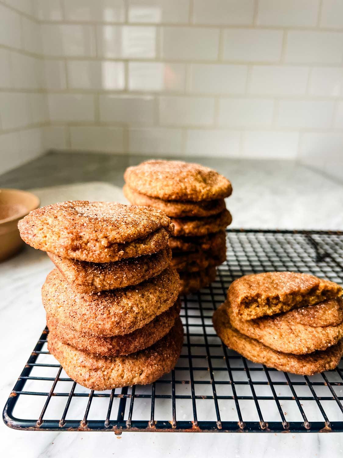 Vintage photo of snickerdoodle cookies cooling on a wire rack in a cozy kitchen