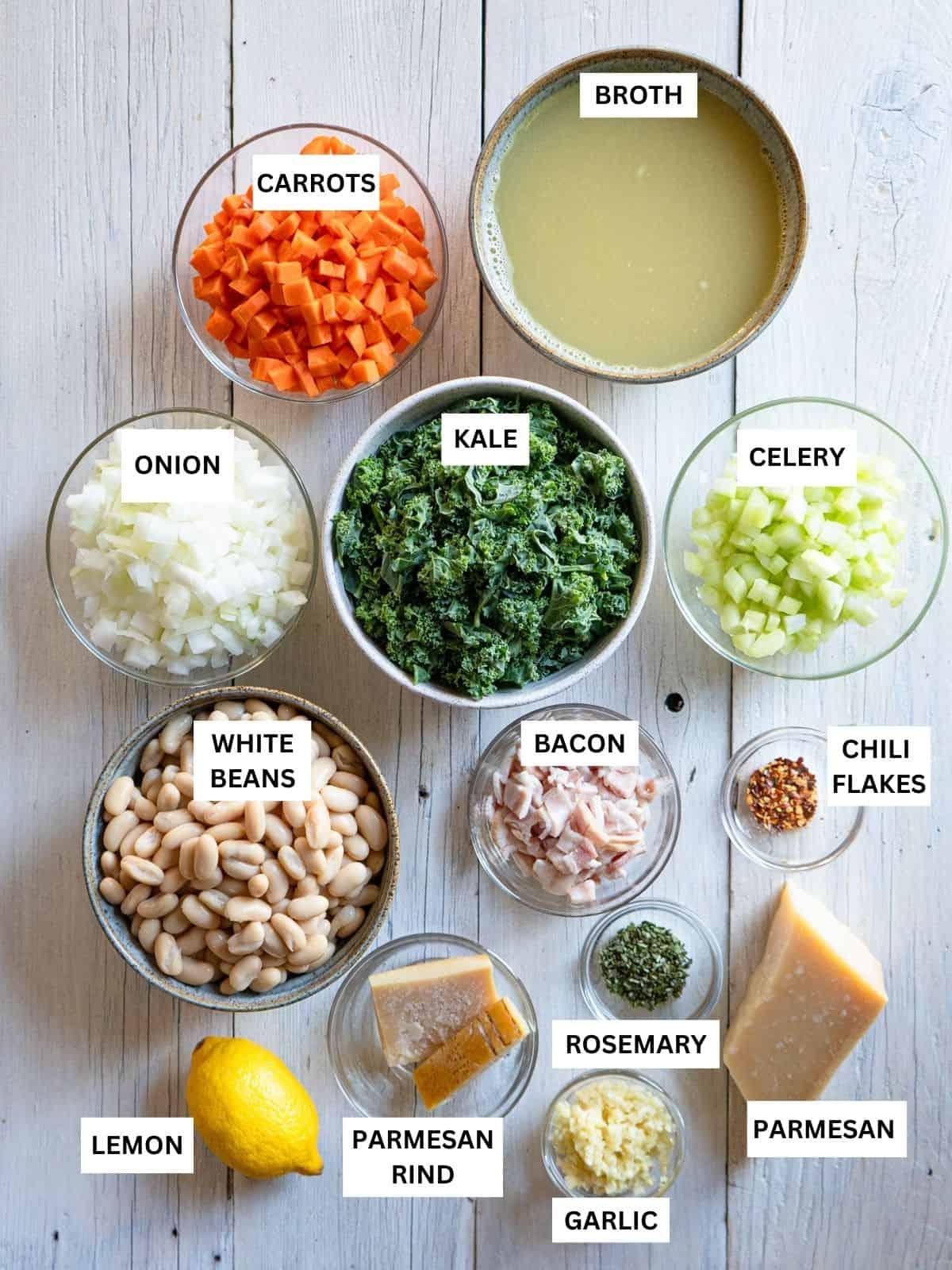 ingredients for Italian White Bean Chili, including white beans, carrots, celery, onion, garlic, herbs, and lemon