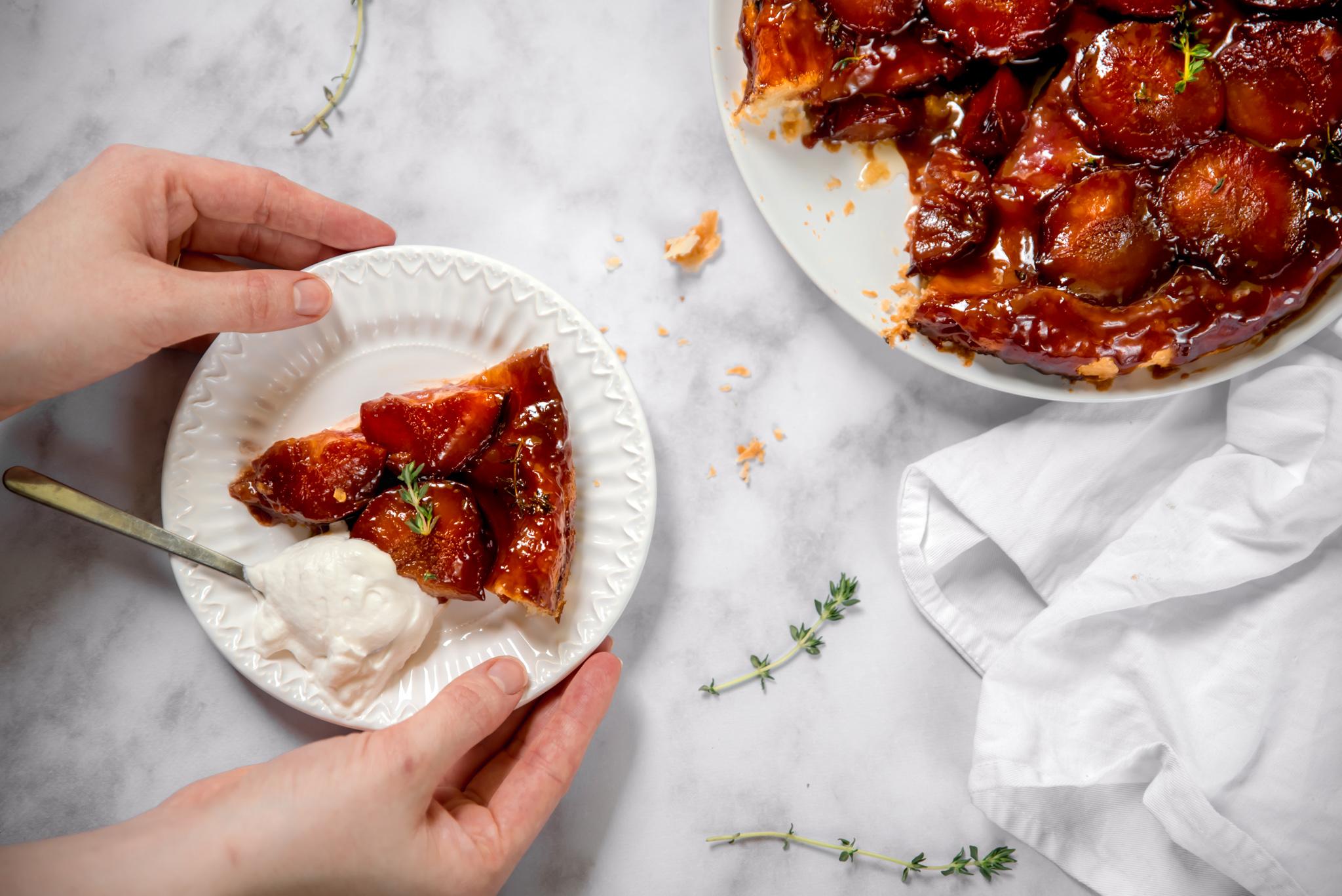 a person preparing plum tart filling with thyme