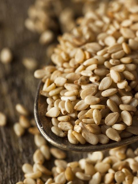 close up of sesame seeds soaking in a glass bowl