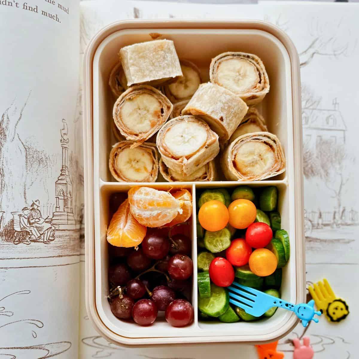 close-up of a beautifully arranged peanut butter banana bento box