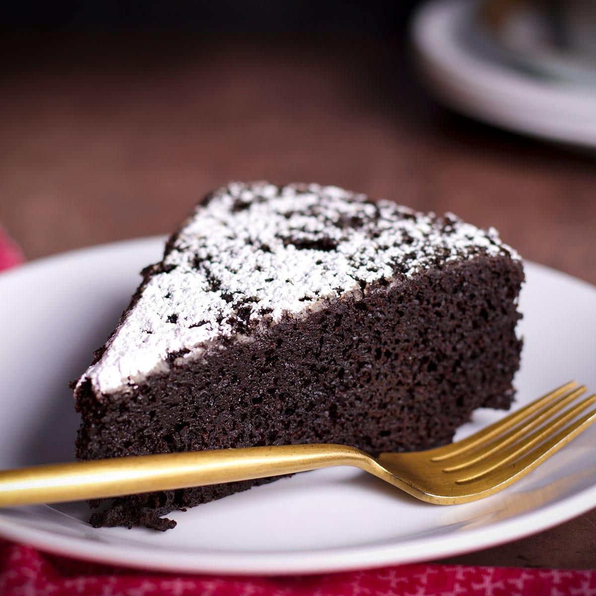 close up shot of a slice of dutch oven chocolate cake
