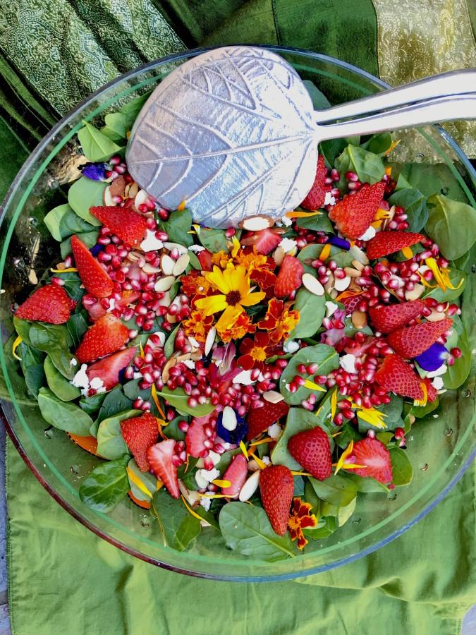 strawberry spinach salad with marjoram flowers close up