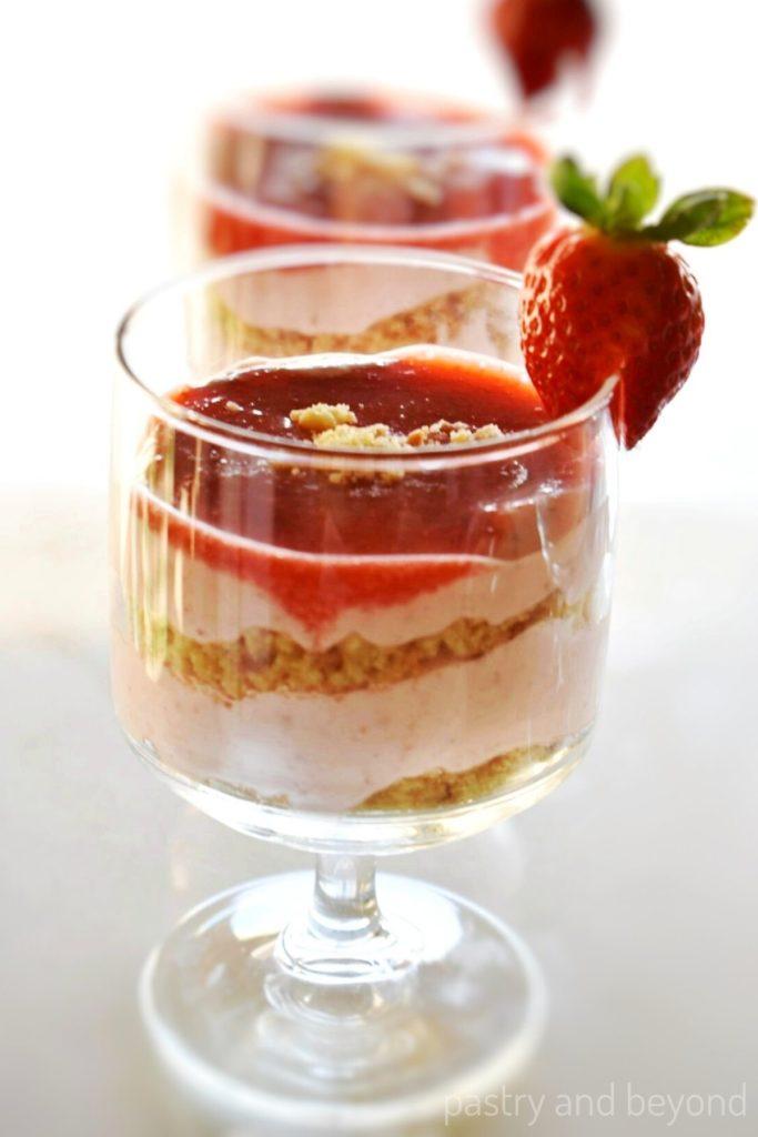 layered strawberry cookie dough mousse dessert in a glass