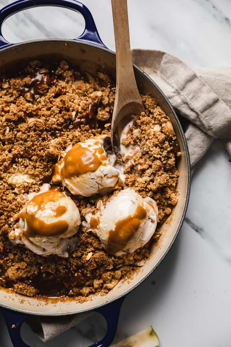 vegan pear crisp served warm with vegan ice cream