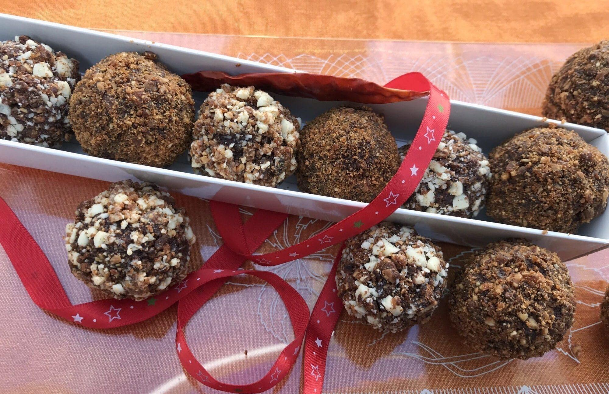 close up of a spicy chocolate truffle with chili powder visible