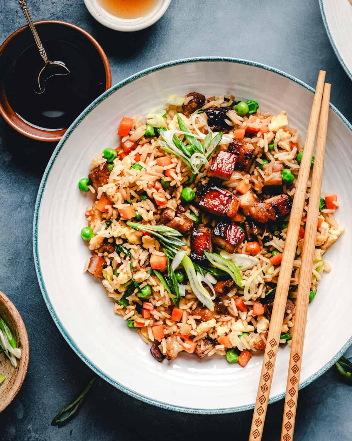 close-up shot of shimane spark fried rice with visible crispy pork belly and green onions