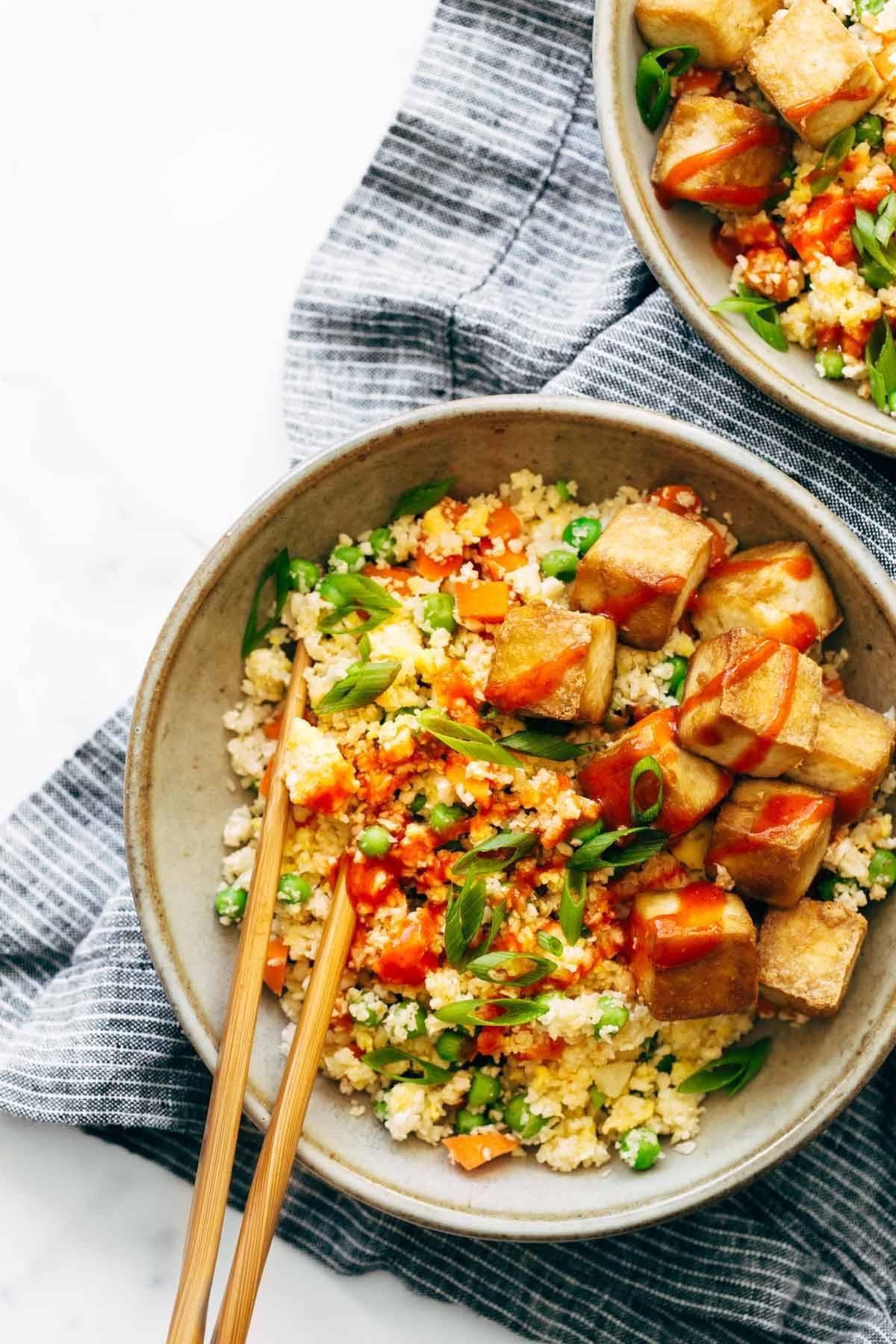Cauliflower rice stir-fry with tofu served in a bowl