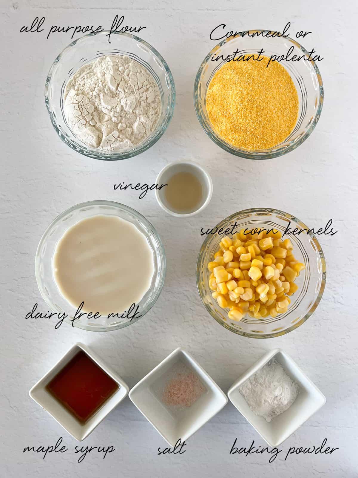 Ingredients for gluten-free cornmeal pancakes laid out on a kitchen counter