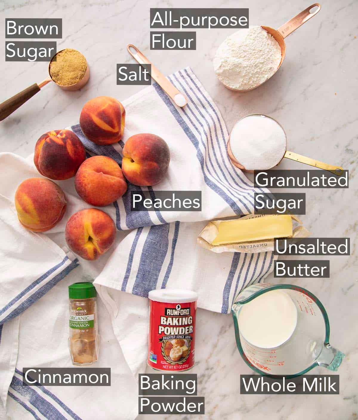 ingredients for peach cobbler on a kitchen counter