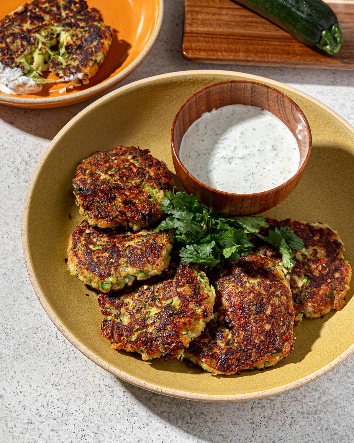 Close-up of mixing Keto Chicken and Zucchini Fritter ingredients in a bowl