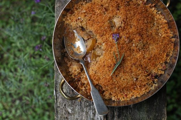 close up shot of a lavender pear crisp in a baking dish
