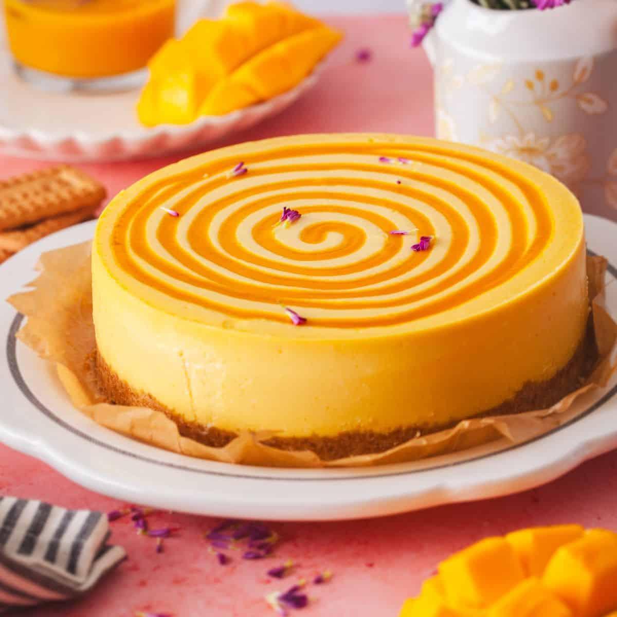 whole Spicy Mango Habanero Cheesecake on a cake stand