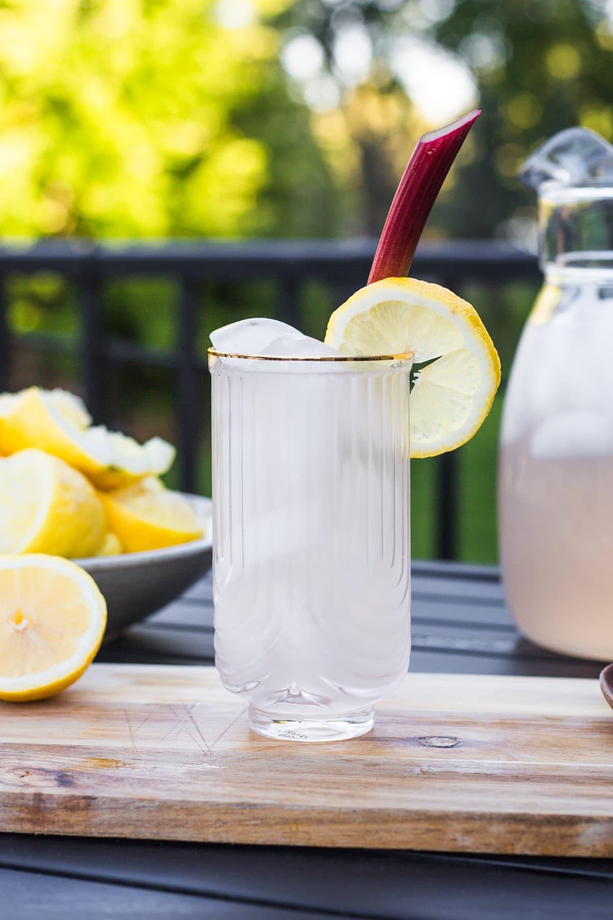pitcher of rhubarb mint lemonade with ice and lemon slices