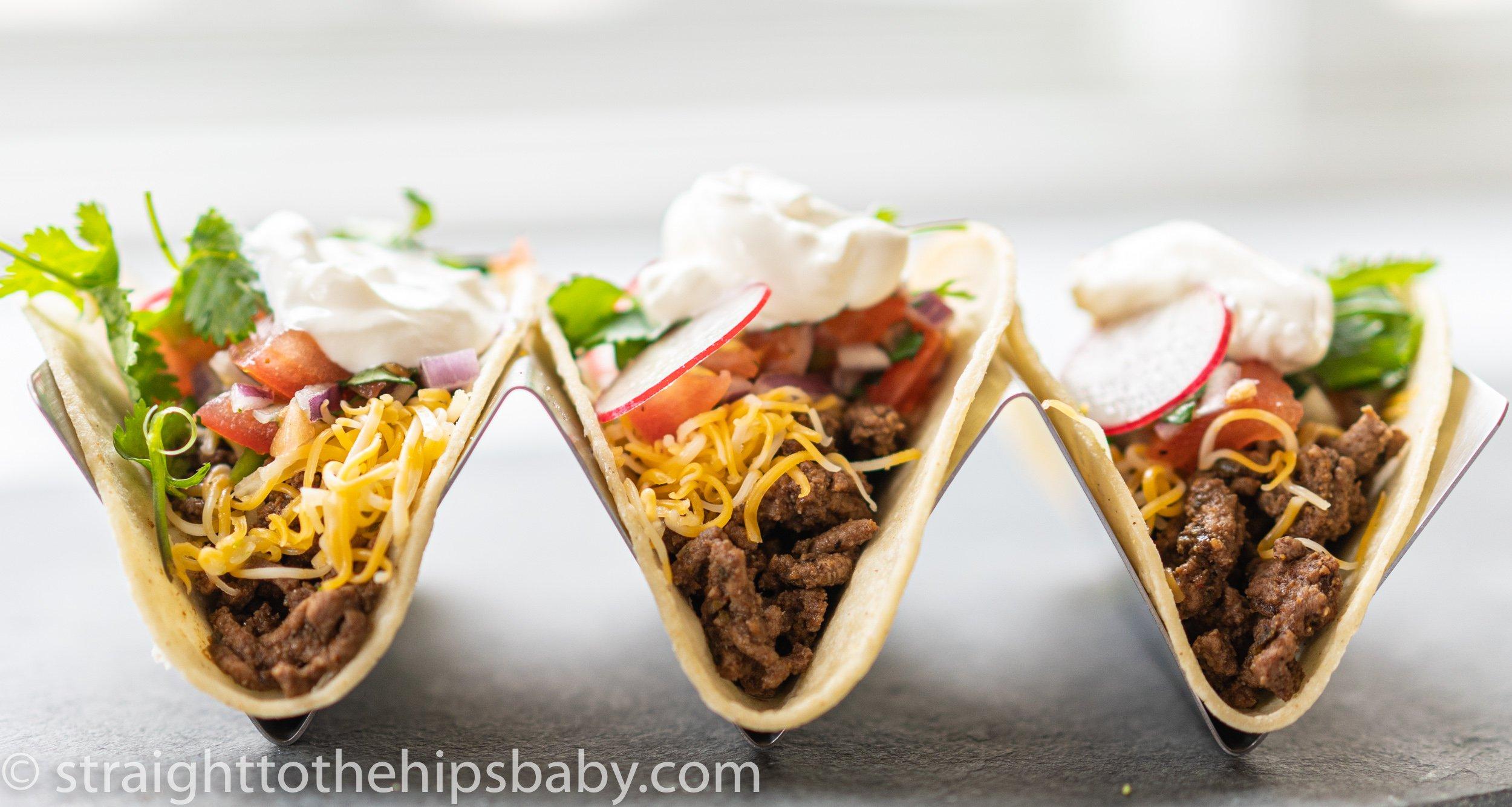 chipotle-lime ground beef tacos topped with cilantro crema