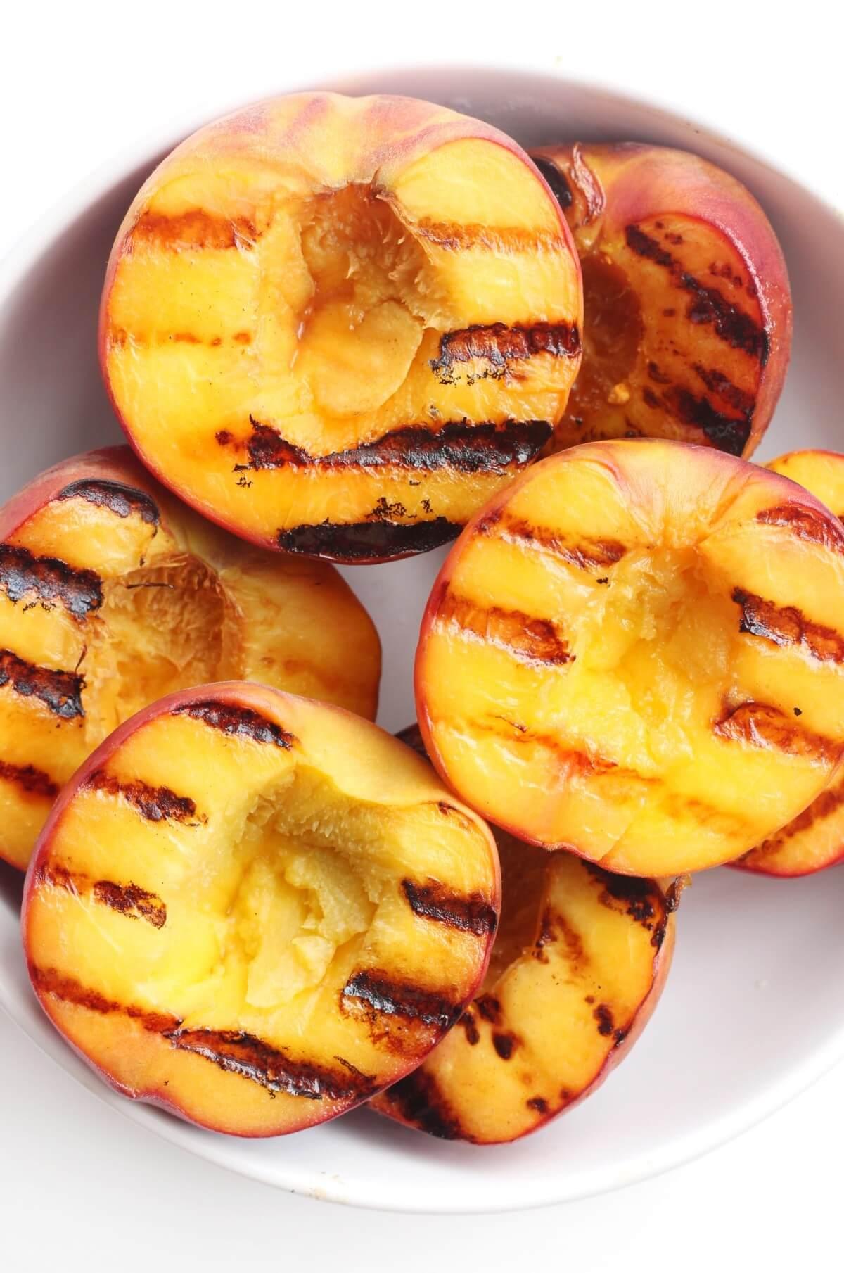 close up of grilled peaches with grill marks