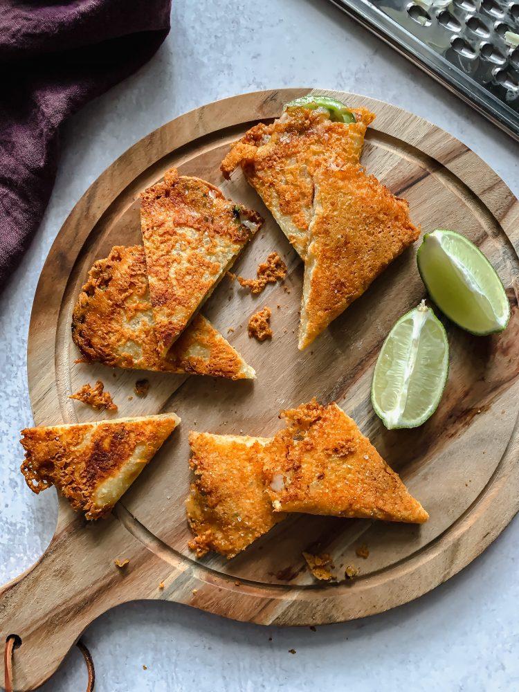 Close-up shot of a Tres Leches Quesadilla being cut, revealing the melted cheese and soaked interior