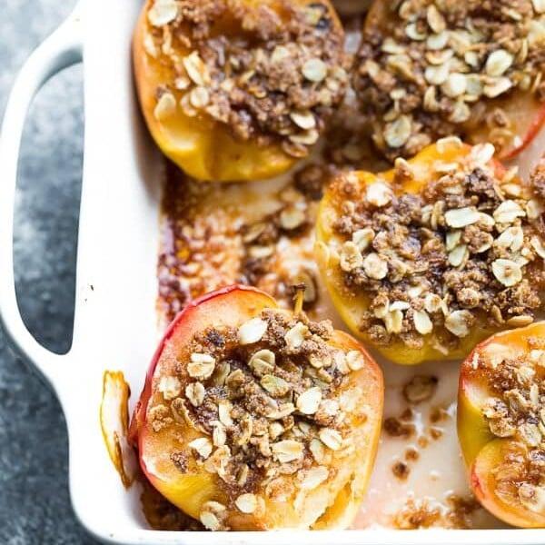 overhead shot of baked apples in a baking dish, with steam rising