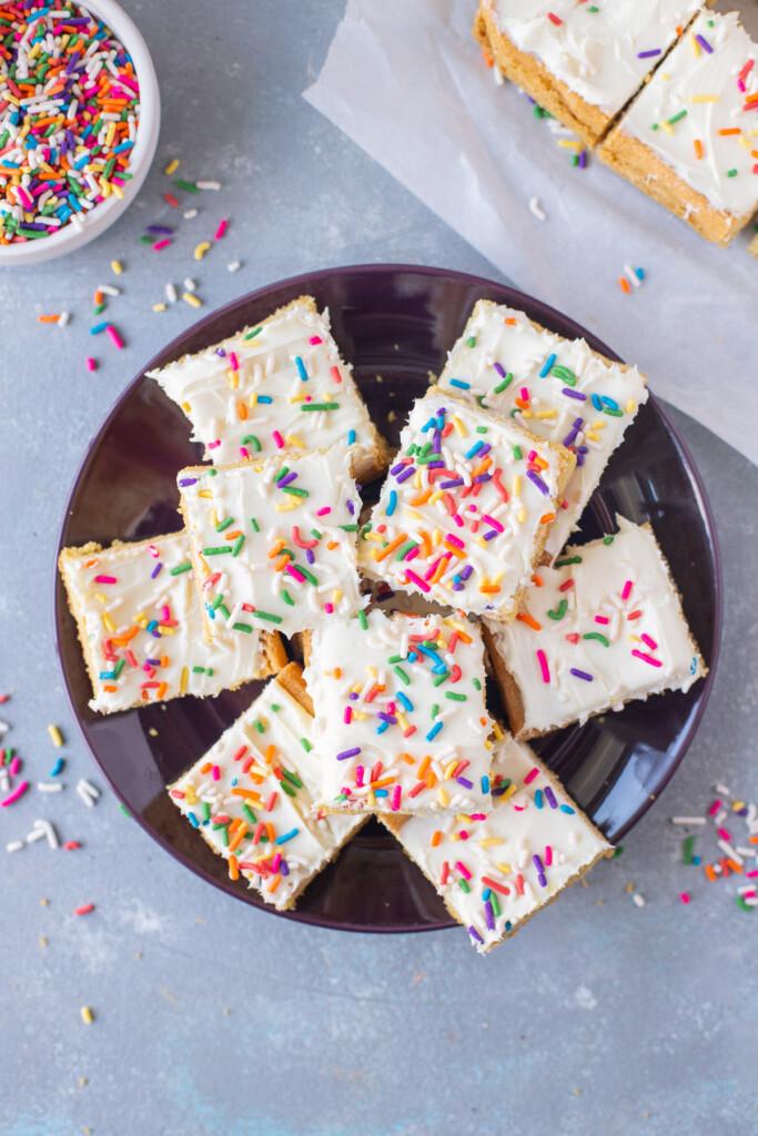 overhead shot of a slice of vanilla cake with M&Ms visible inside