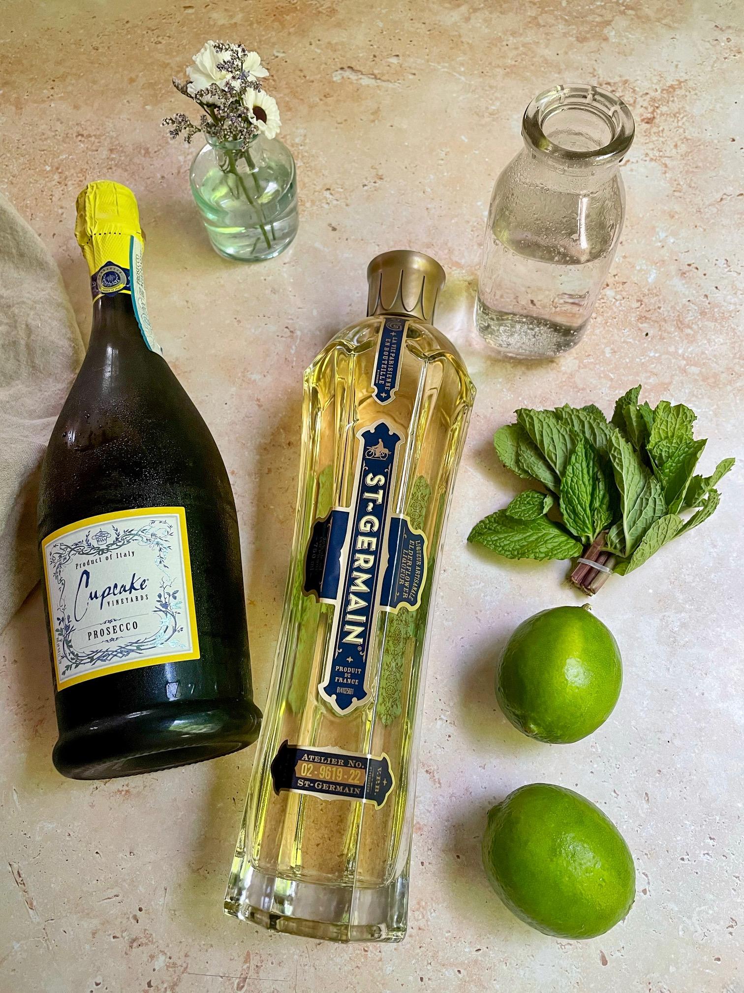 preparing plum anise hugo spritz ingredients on a bar