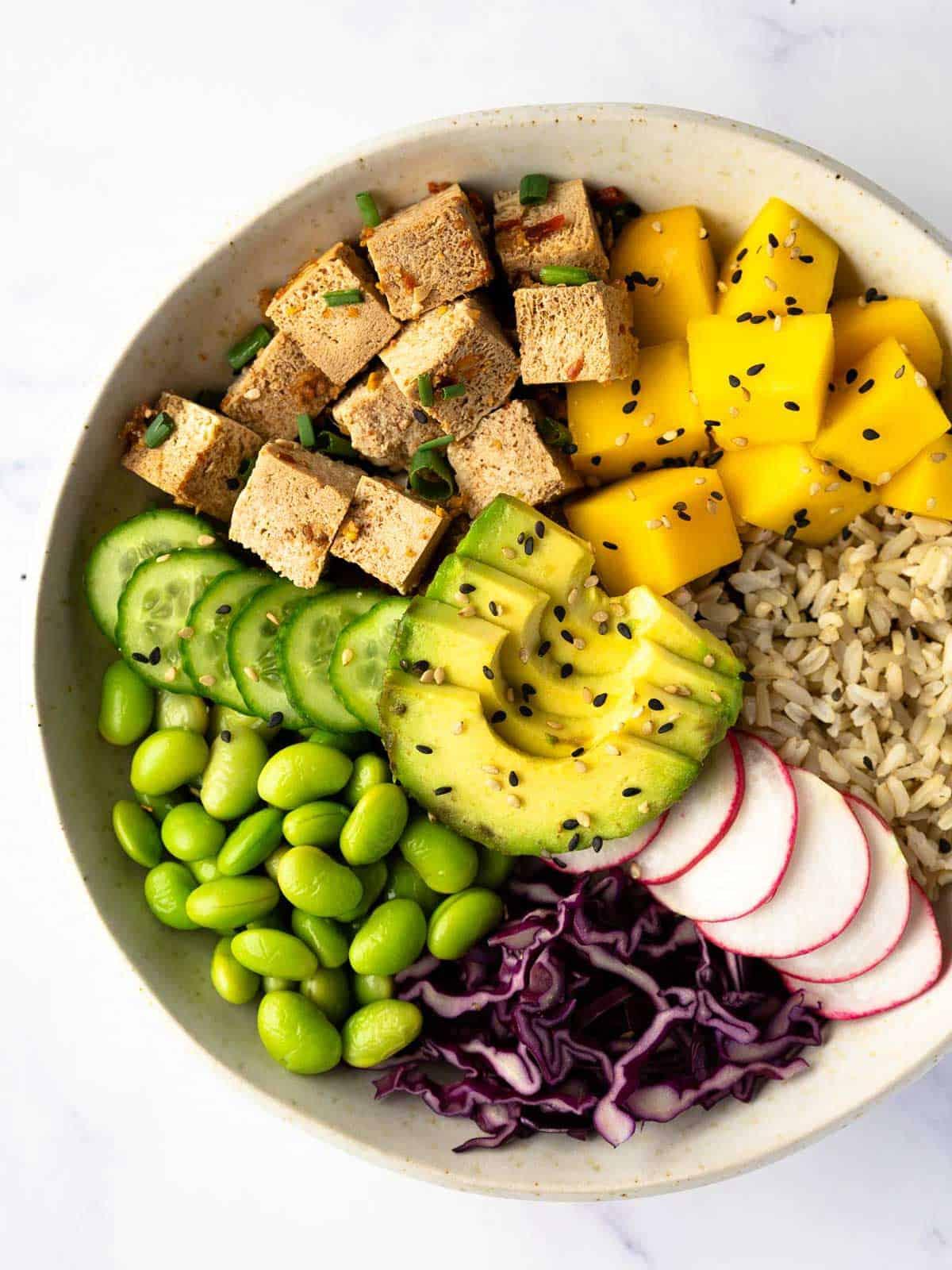 close-up of a colorful rainbow veggie sushi bowl