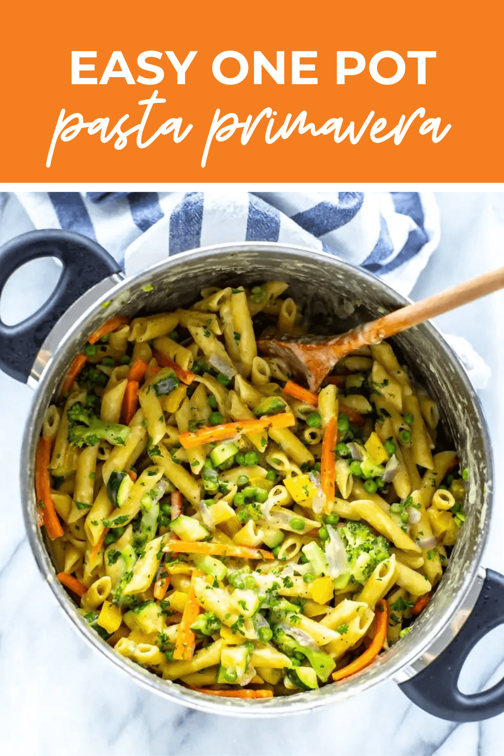 Overhead shot of the one-pot pasta primavera being stirred in a pot