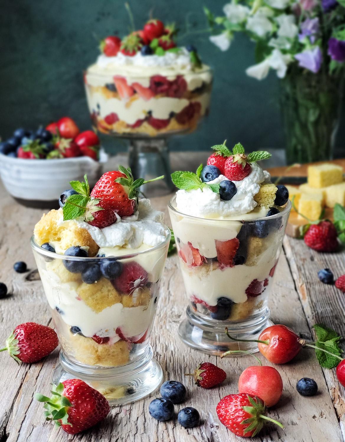 layered summer berry trifle in a shot glass