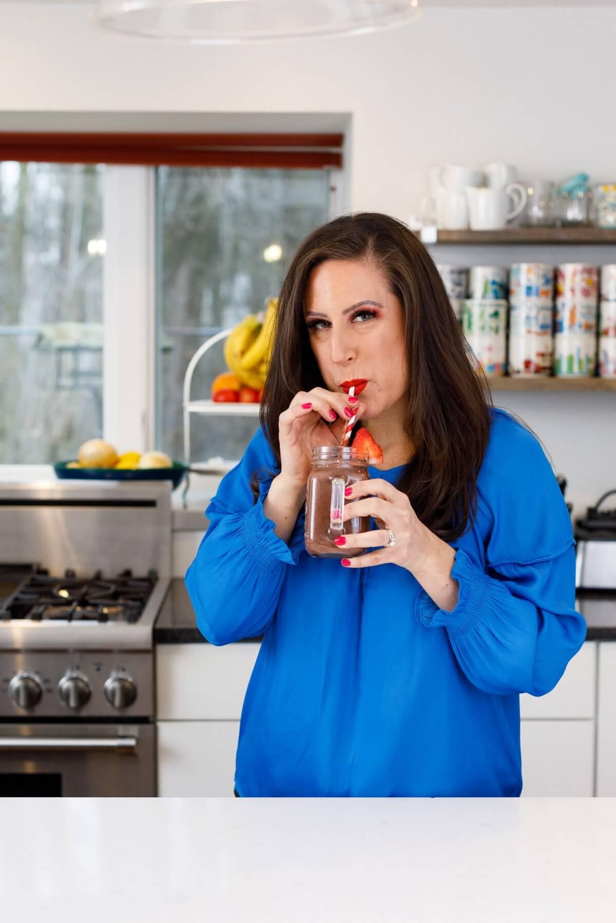 a woman preparing smoothie bags with tropical fruits in her kitchen
