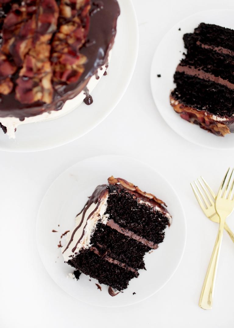 close up shot of a slice of chocolate maple bacon layer cake