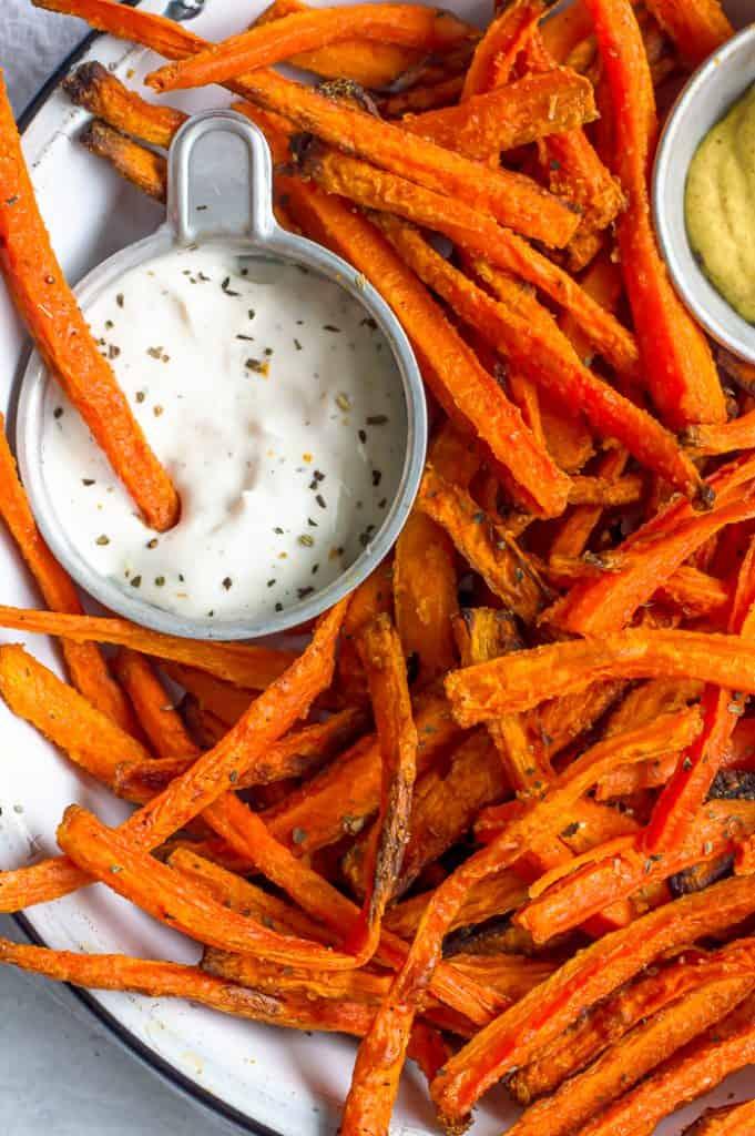 close up of ginger sesame carrot fries on a plate