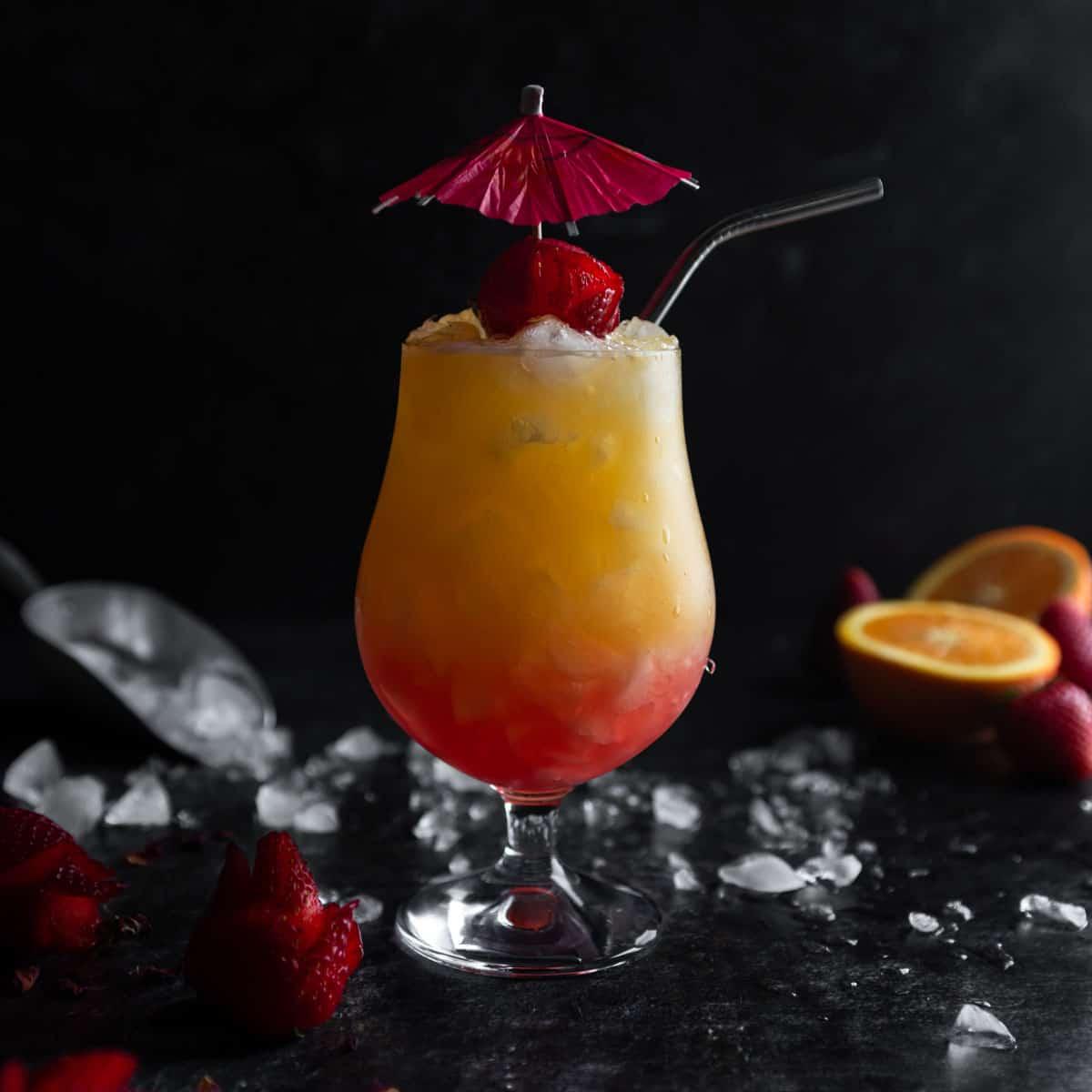 Strawberry Lemonade Tequila Sunrise cocktail in a highball glass