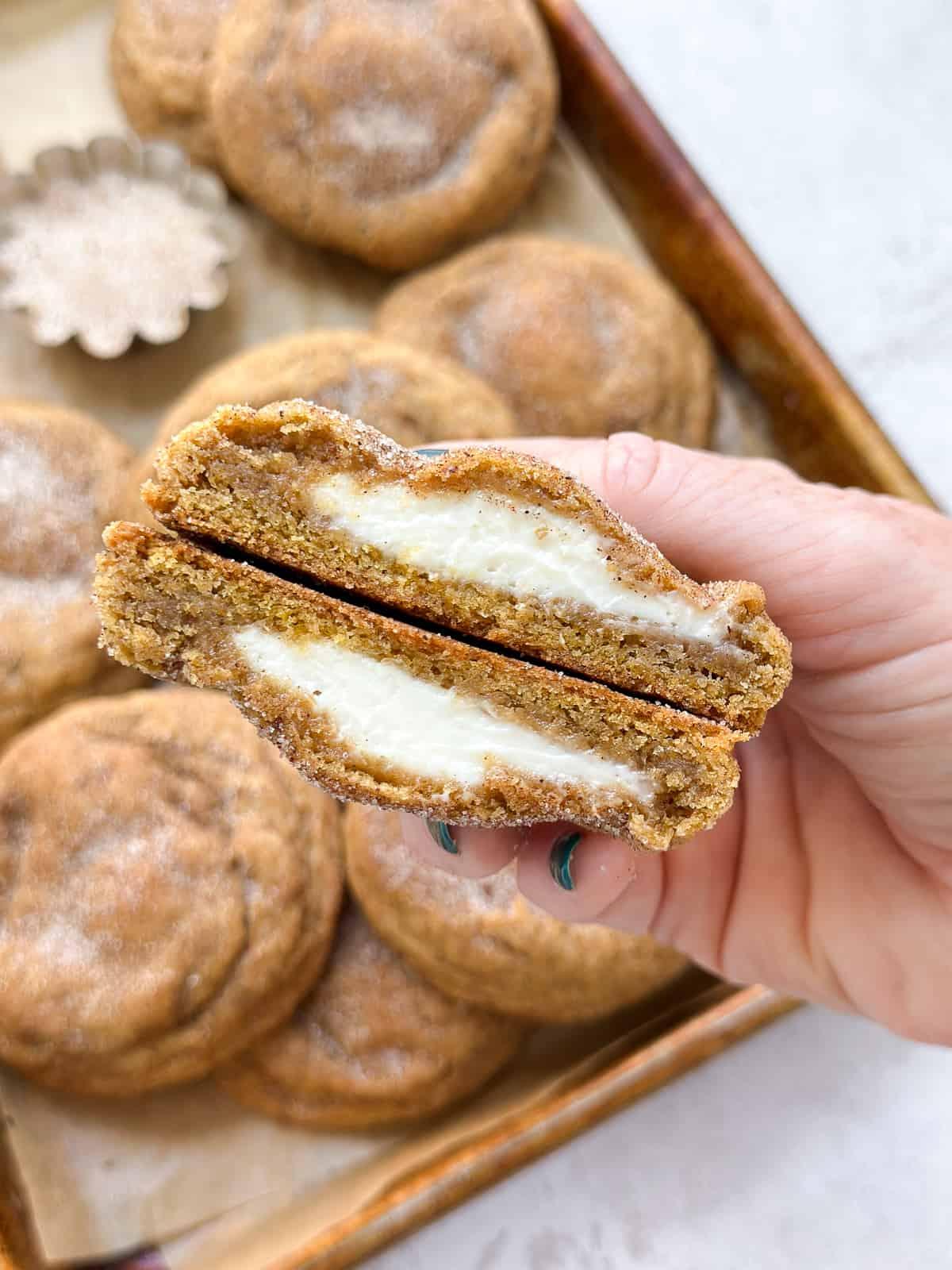 Snickerdoodle Pumpkin Cheesecake slice on a plate with a cup of coffee