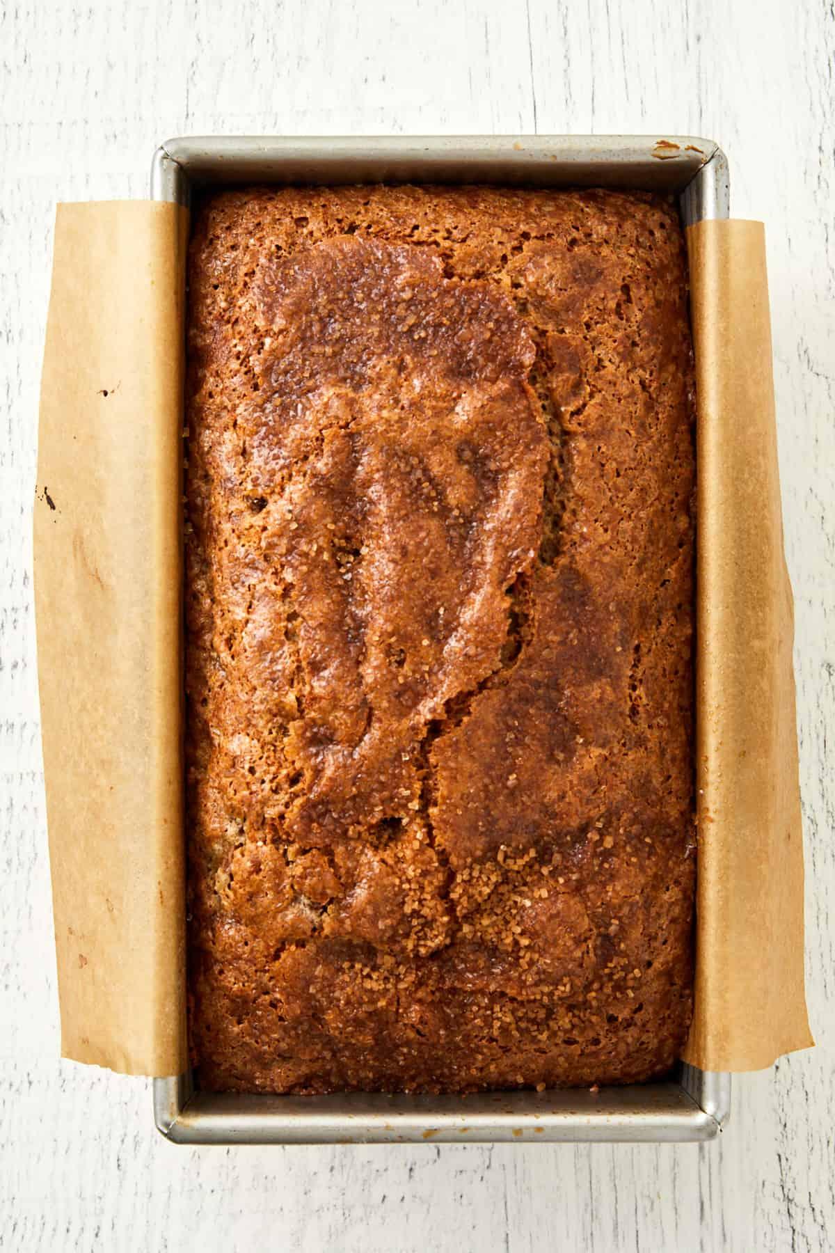 a loaf of rhubarb banana bread cooling on a wire rack