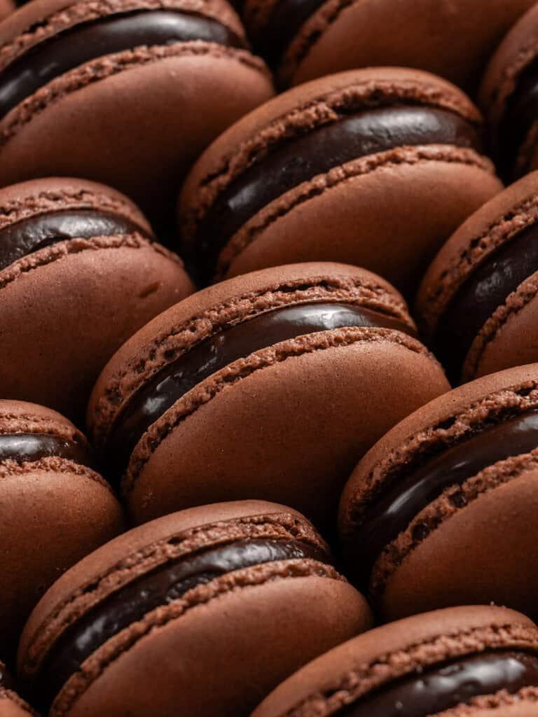 close up of stack of brownie macarons