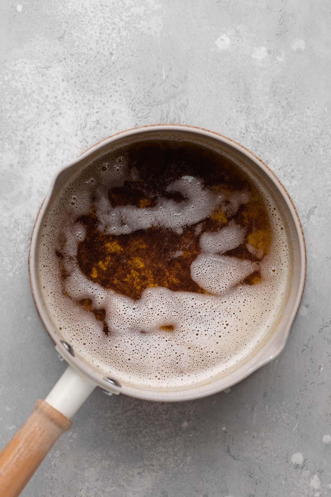 Close-up shot of brown butter sauce being made in a pan