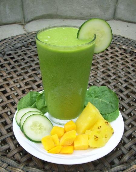 close-up shot of a cucumber and coconut smoothie with visible chunks of cucumber and coconut