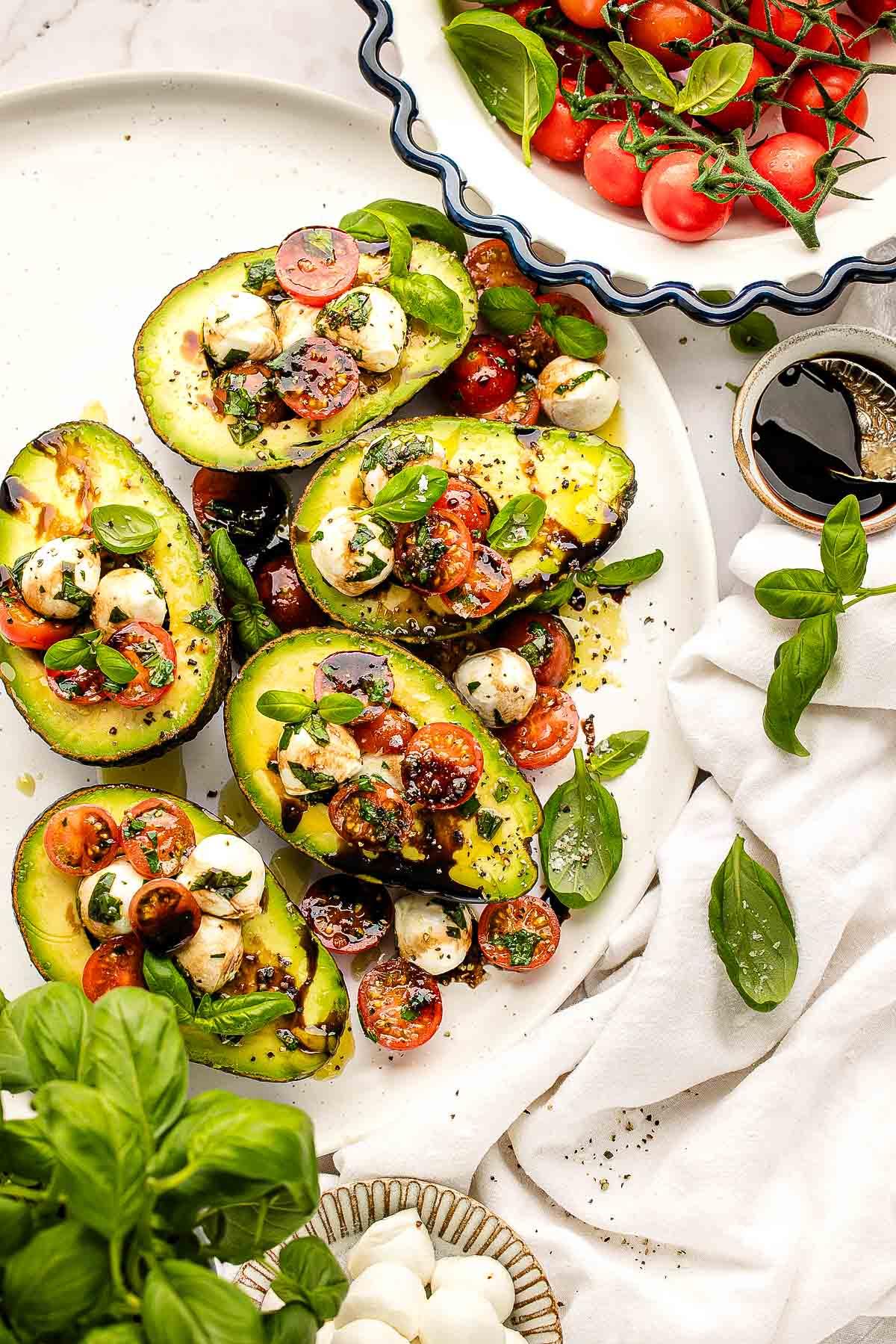 Caprese stuffed avocados on a camping table