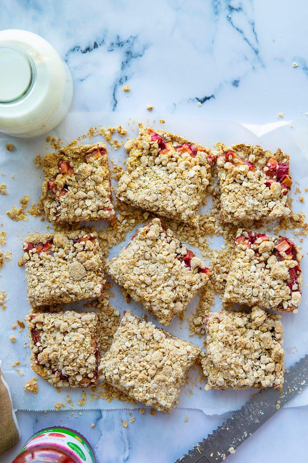 Overhead shot of rhubarb and strawberry shortbread bars arranged on a cooling rack
