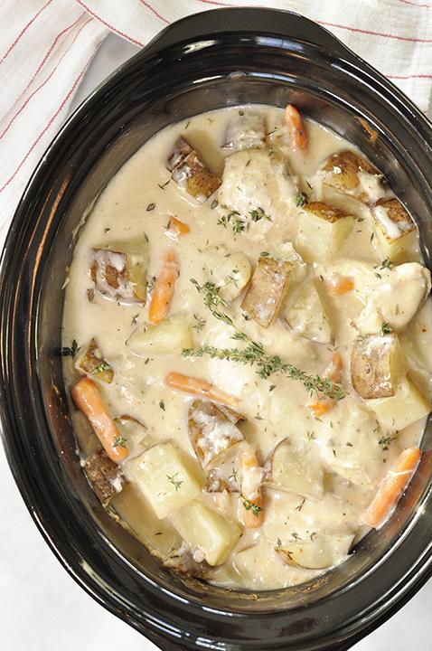 close-up shot of creamy chicken and potatoes in a crockpot