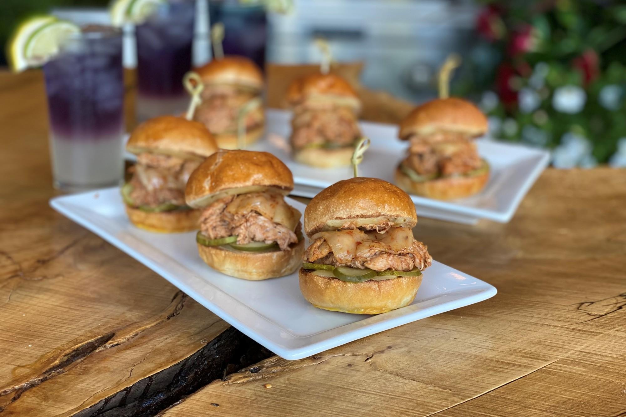 Apple Cinnamon BBQ Duck Sliders on a rustic wooden board