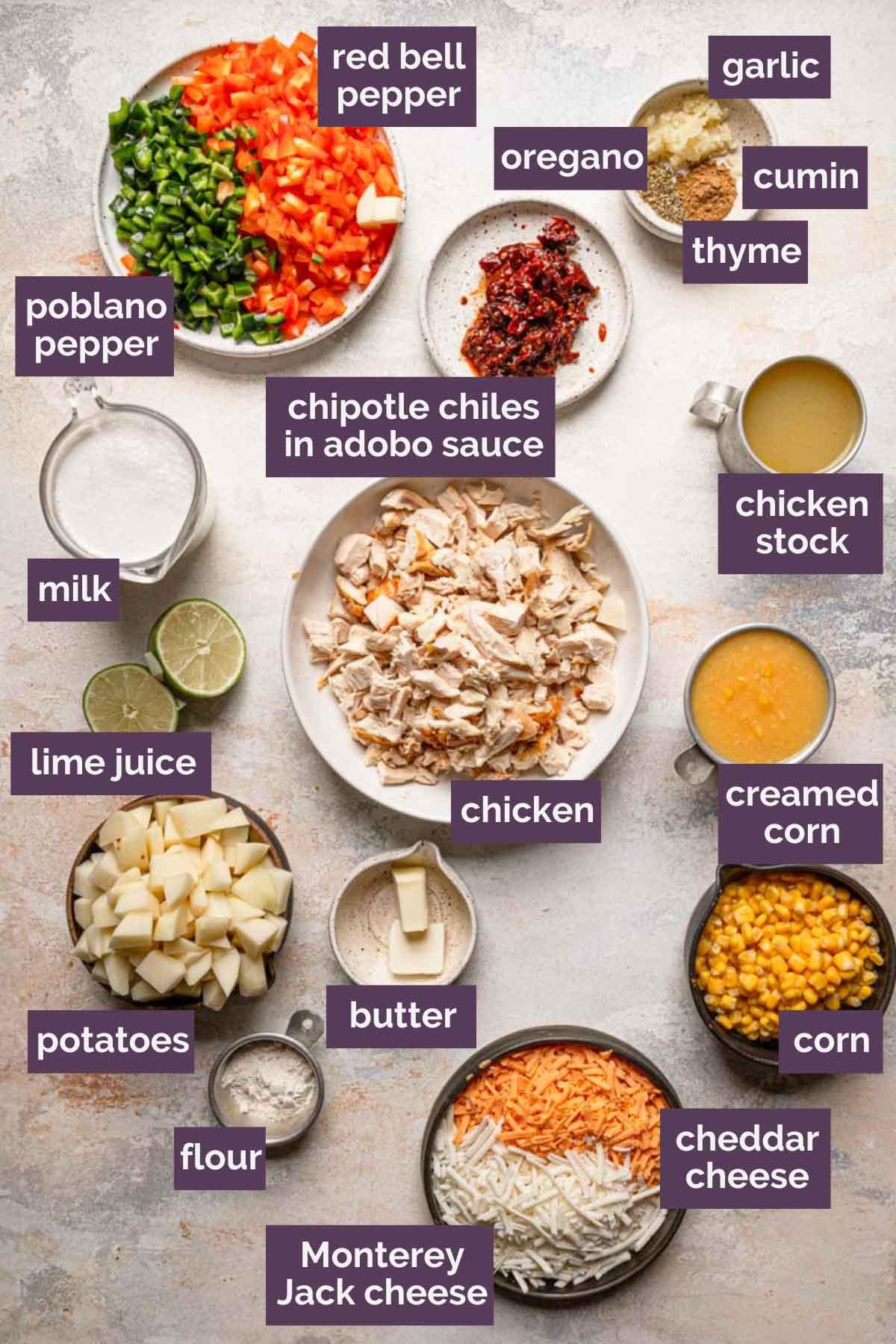 Ingredients for spicy corn chowder with chipotle peppers laid out on a wooden table