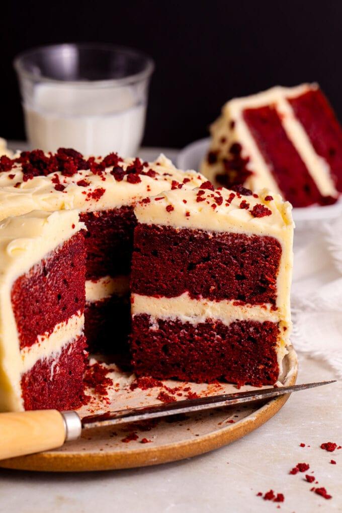 whole ruby red velvet cake decorated with fresh beetroot slices
