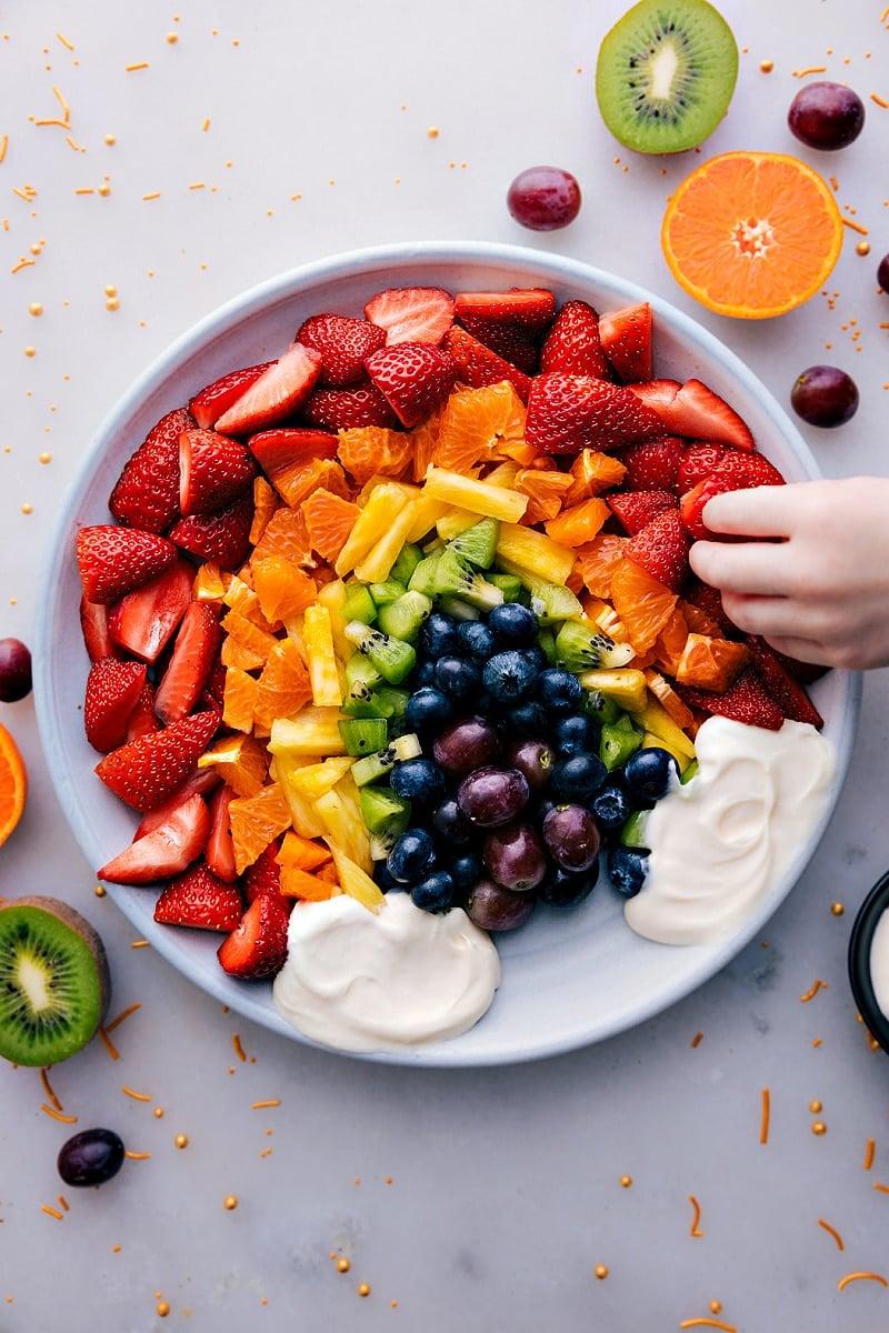 Overhead shot of a perfectly arranged rainbow fruit platter