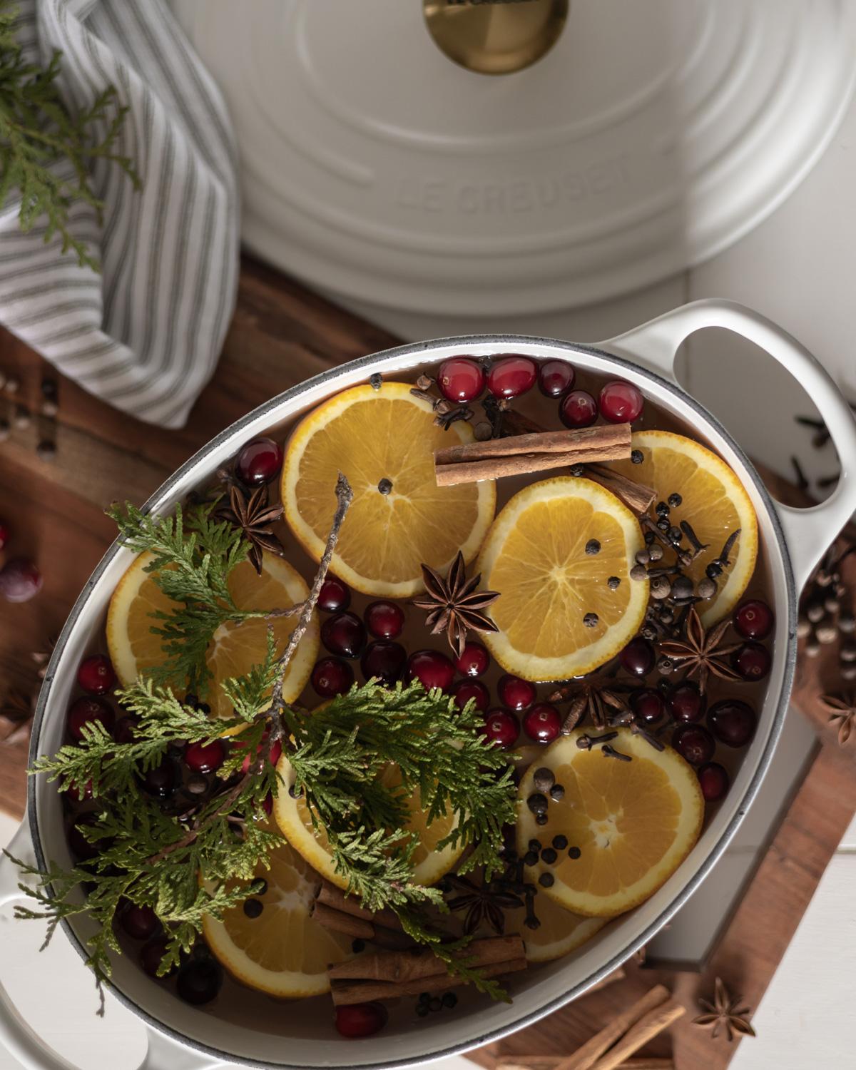 Grandma's cozy kitchen during Christmas, vintage aesthetic, warm lighting, simmer pot on stove