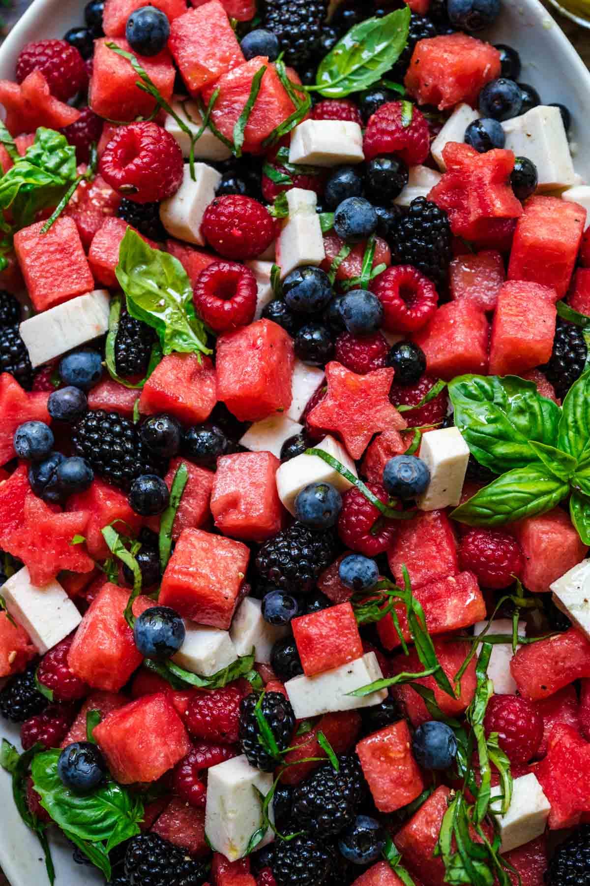 close up of strawberries, blueberries and watermelon on the platter